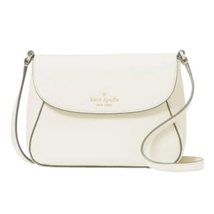 A white Kate Spade crossbody bag with a flap closure and gold logo detailing, featuring a slim adjustable strap.