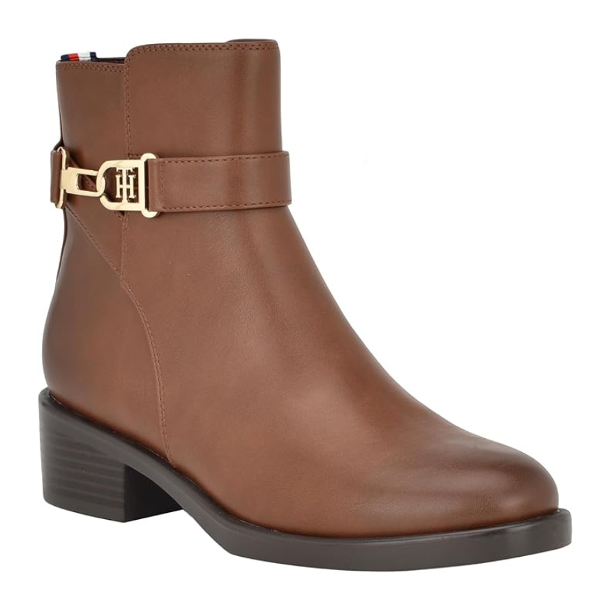 Brown ankle boot with a low block heel and gold buckle detail.