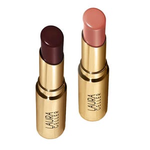 The Laura Geller Jelly Lip Balm Duo consists of two lip balms in gold tubes, featuring a deep burgundy and a light pink shade.