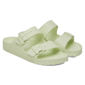 Pale green Birkenstock sandals made from lightweight EVA material, featuring two adjustable straps with buckles and a contoured footbed for comfort.