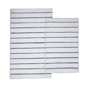 Two white bath rugs with horizontal black stripes, one larger and one smaller, overlapping slightly.