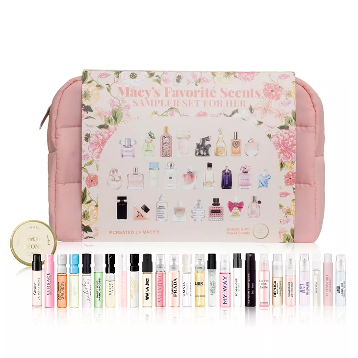 Macy's Favorite Scents Sampler Set for Her includes 26 fragrance vials from various brands, accompanied by a travel candle. The set is displayed in a floral-themed package with a pink padded carrying case.