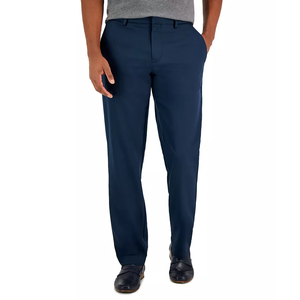 Navy blue Perry Ellis dress pants with a straight fit and a flat front design, paired with black shoes.