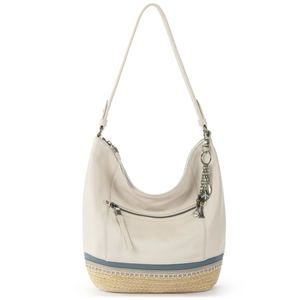 A white hobo bag with a single strap, featuring a front zipper pocket and a decorative charm. The base has a woven jute texture with a light blue accent stripe.