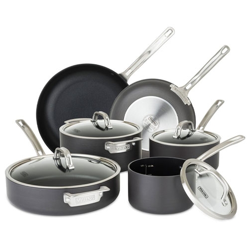 A set of nonstick cookware including various pots and pans with glass lids, featuring stainless steel handles.