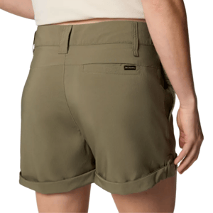 A person wearing olive green Columbia shorts with rolled cuffs and belt loops, featuring a small label on the back pocket.
