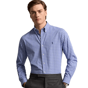 Polo Ralph Lauren Gingham Dress Shirt features a light blue and white checked pattern, button-down collar, and a small embroidered logo on the chest. The shirt is paired with gray trousers.