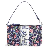 A floral-patterned handbag with a navy and cream color scheme, featuring a zip closure and a detachable shoulder strap.