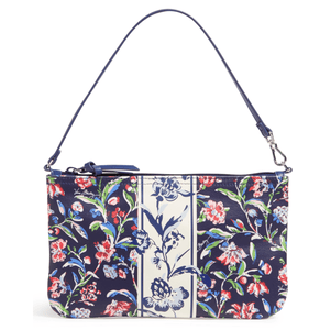 A floral-patterned handbag with a navy and cream color scheme, featuring a zip closure and a detachable shoulder strap.