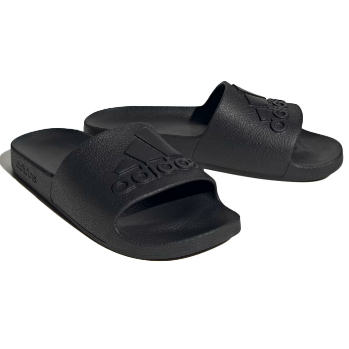 A pair of black Adidas slides featuring the Adidas logo on the strap, designed for casual comfort.