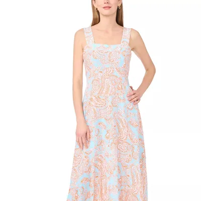 Sleeveless dress with a square neckline, featuring a light blue and orange paisley pattern.