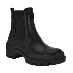 Black leather Chelsea boots with a lug sole, featuring elastic side panels and a pull tab. The upper has a textured pattern with a triangular logo detail.