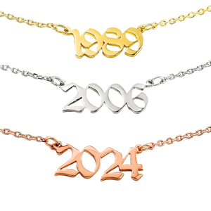 Three necklaces displaying years in different metal finishes: \“1989\“ in gold tone, \“2006\“ in silver tone, and \“2024\“ in rose gold tone, each mounted on delicate chains.