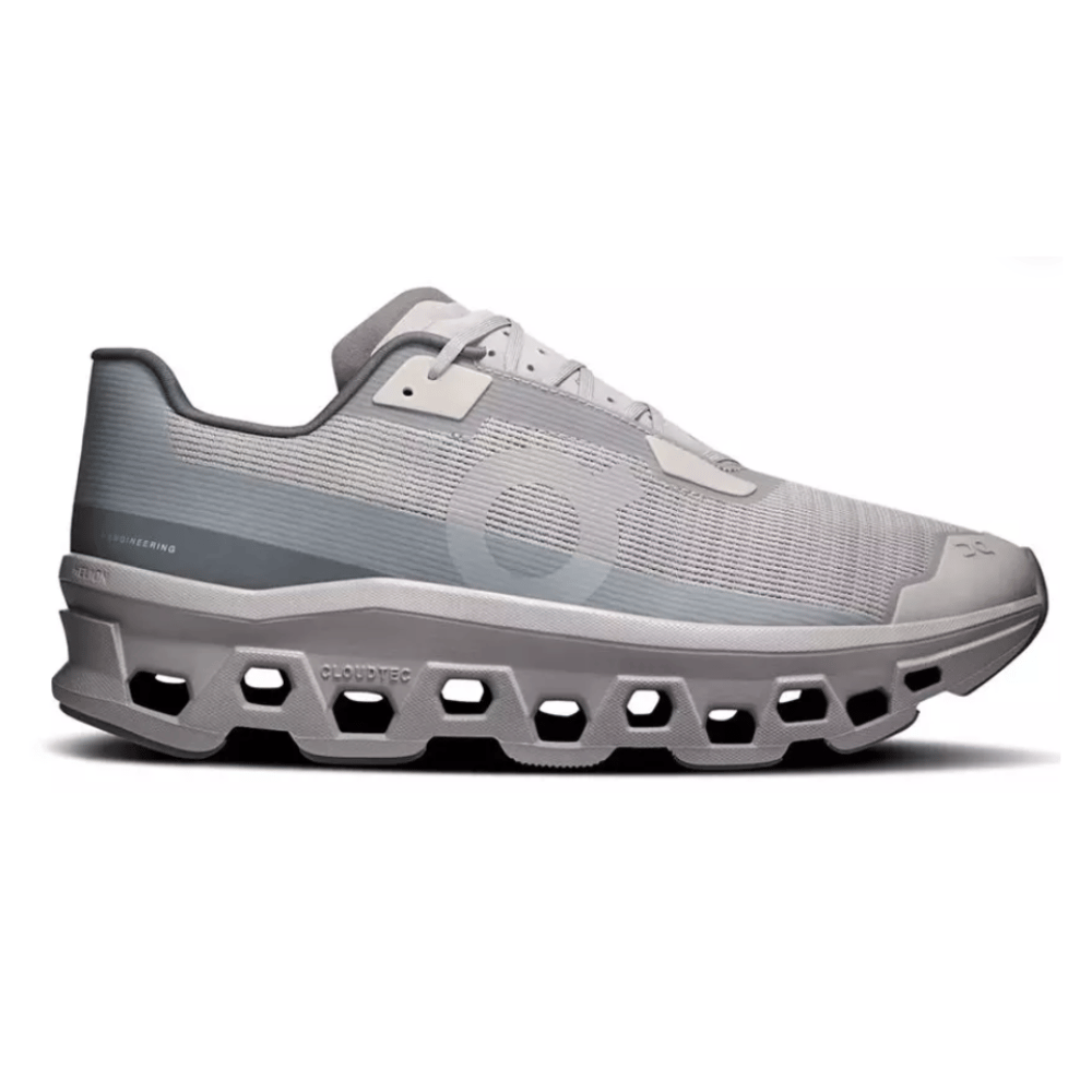 A gray athletic shoe with a distinctive geometric sole design featuring CloudTec technology, offering a sleek and modern look.