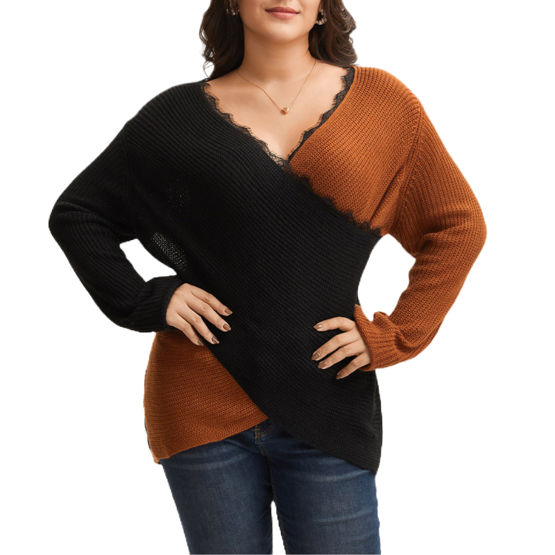 A woman is wearing a two-tone V-neck sweater with black and brown colors, featuring a lace detail along the neckline, and paired with blue jeans.