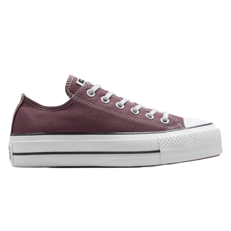 Converse Chuck Taylor Platform Canvas sneaker in plum features a low-top design with a thick white rubber sole, white laces, and metal eyelets, providing a classic yet elevated look.