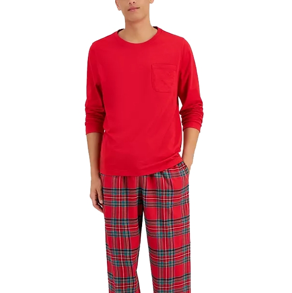 A person is wearing a bright red long-sleeve shirt with a chest pocket paired with red plaid pajama pants.