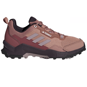 Adidas Terrex hiking shoes in a pink and burgundy colorway feature a rugged design with a textured mesh upper, sturdy sole, and the iconic three stripes for trail durability.