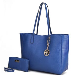 Blue tote bag with crocodile texture and a gold chain with a circular M charm, accompanied by a matching blue wallet displaying \“Mia K. Collection\“.