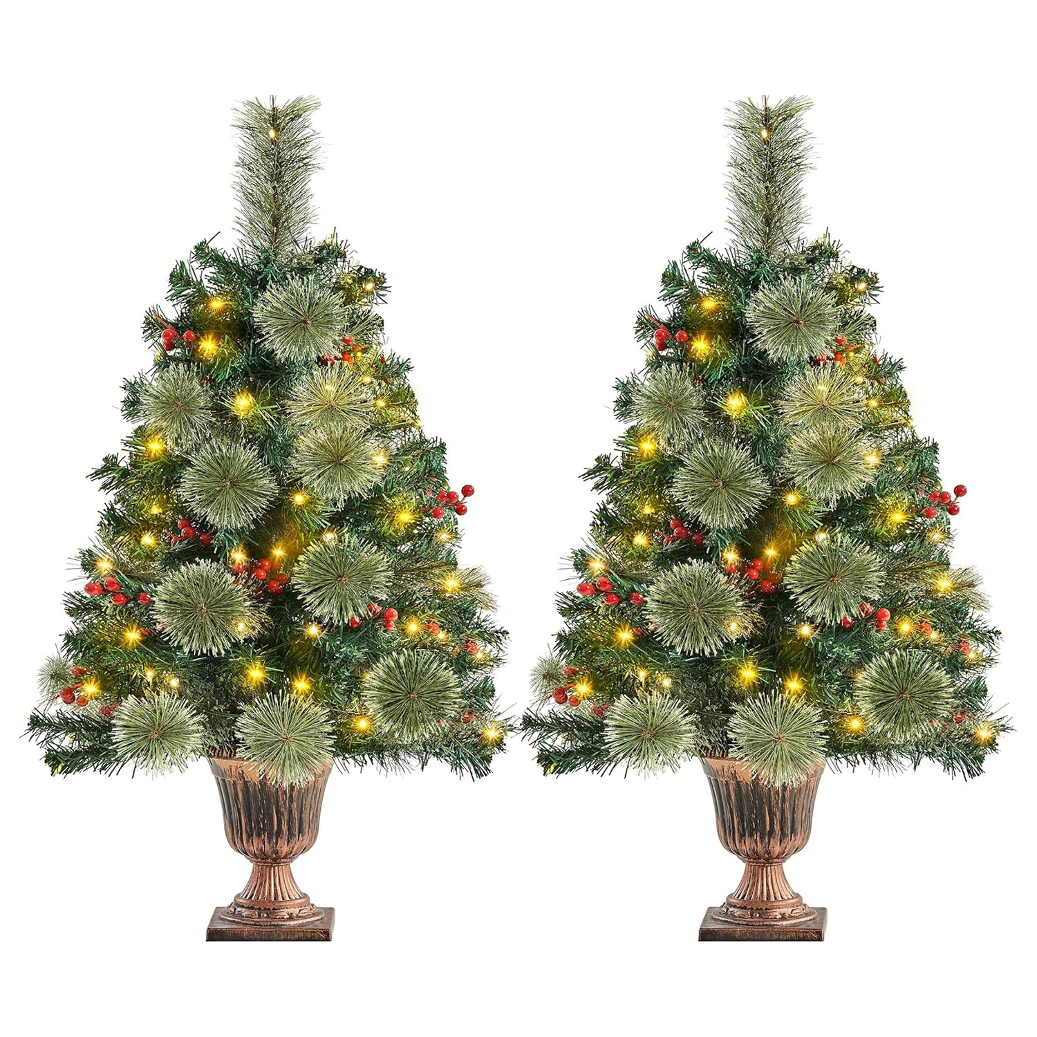 Two identical decorated artificial Christmas trees with lights and red berry ornaments.