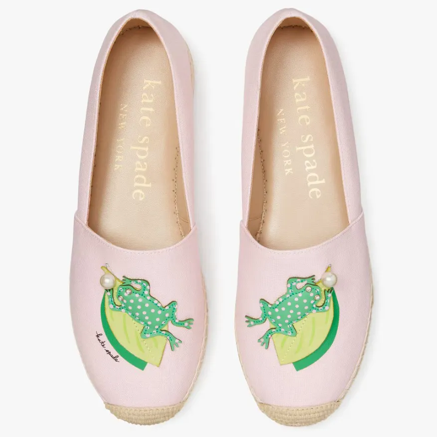 Pink espadrille flats with a green frog wearing a pearl illustration on the toe.