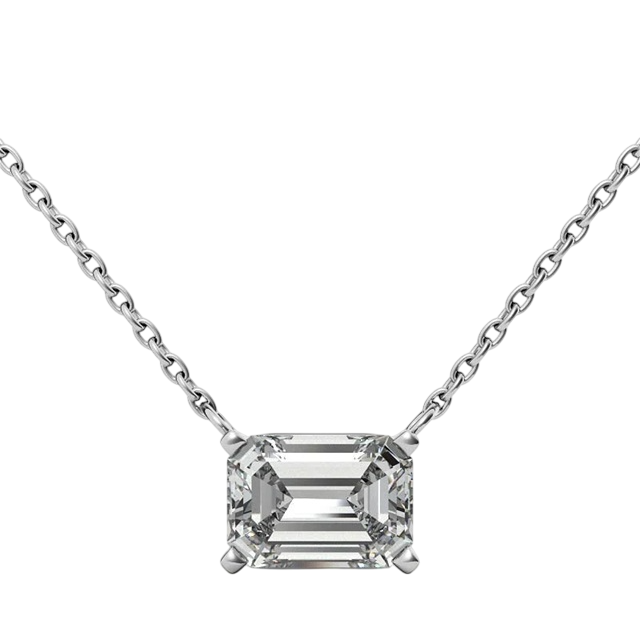 A necklace with an emerald-cut diamond pendant set in a four-prong style on a delicate chain.