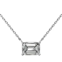 A necklace with an emerald-cut diamond pendant set in a four-prong style on a delicate chain.