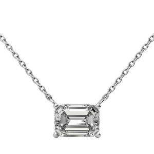 A necklace with an emerald-cut diamond pendant set in a four-prong style on a delicate chain.