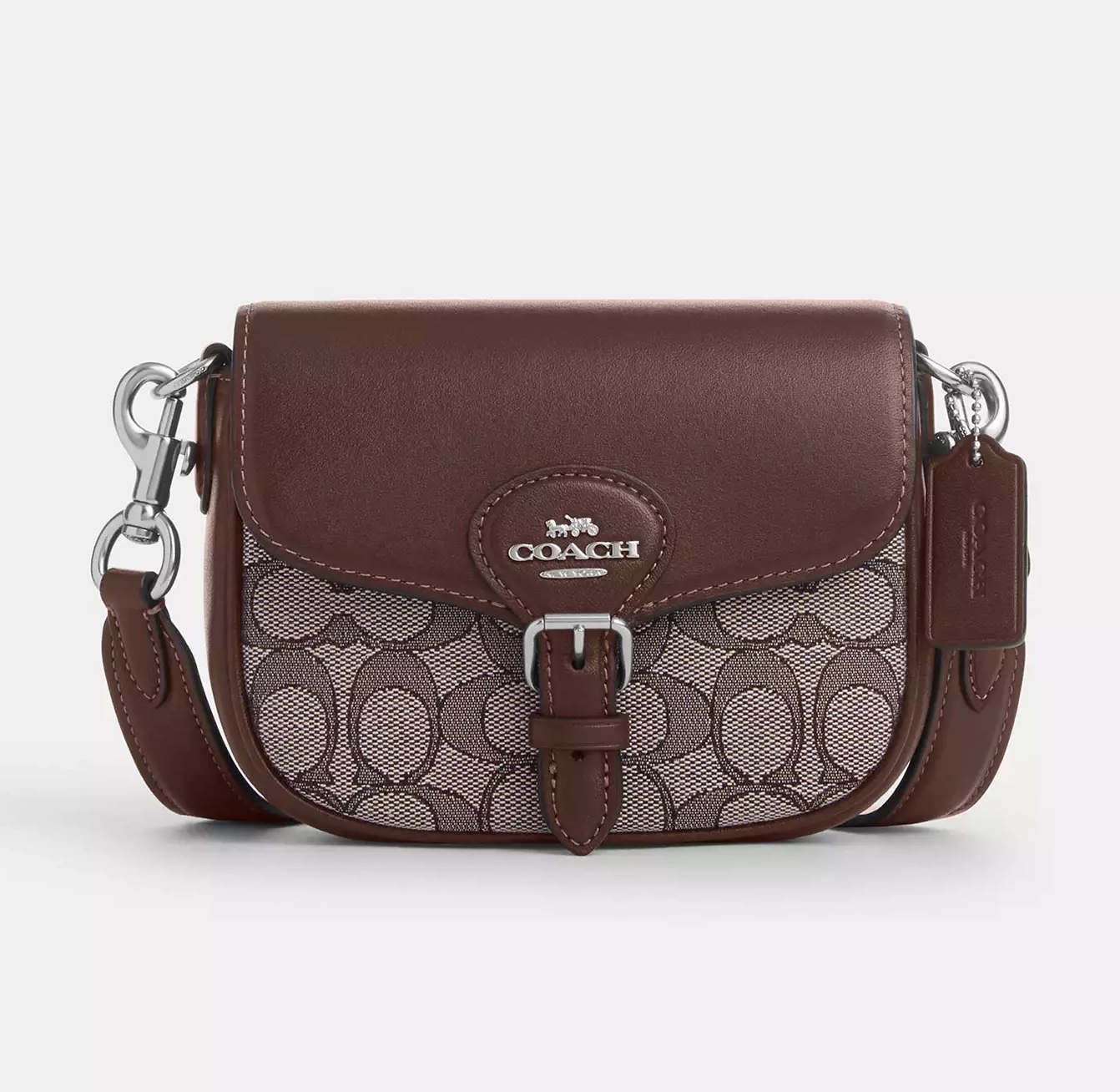 Brown Coach shoulder bag featuring the brand's signature monogram pattern and leather accents.