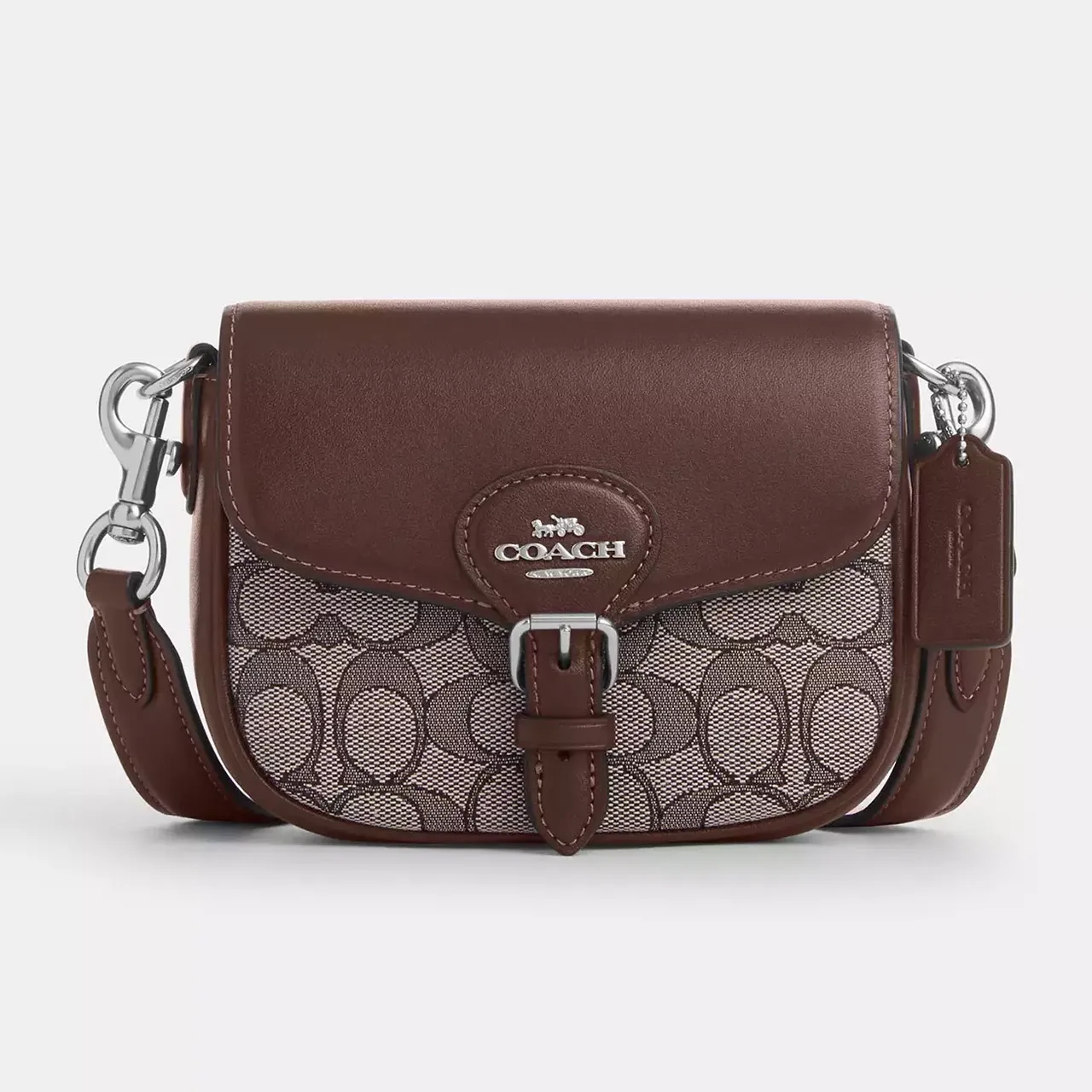 Brown Coach shoulder bag featuring the brand's signature monogram pattern and leather accents.