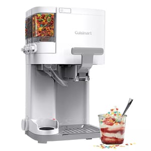 Cuisinart soft serve ice cream maker with mix-in dispensers for toppings like sprinkles or chocolate chips. Includes a drip tray and features a glass with decorated ice cream.