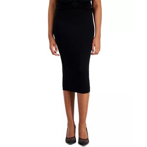 Black, fitted, pull-on midi skirt by Bar III made of jersey fabric, extending to mid-calf. Paired with black pointed-toe heels.