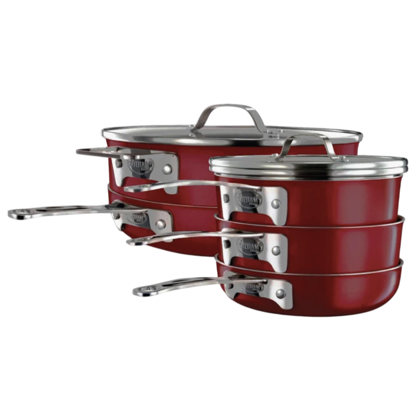 Red stacking cookware set with stainless steel lids and handles, featuring a compact design for easy storage.