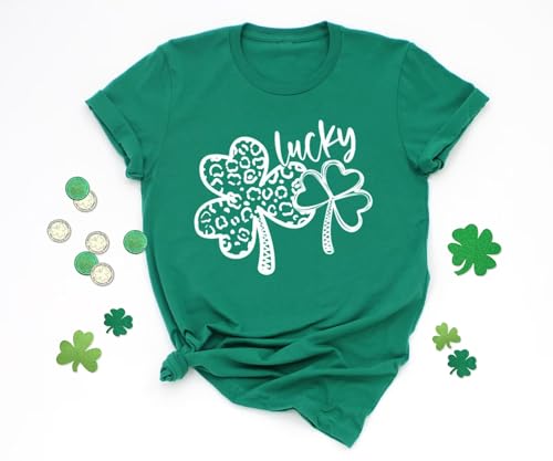A green t-shirt with two shamrocks, one featuring a leopard print, alongside the word \“lucky.\“ Surrounded by gold coins and additional shamrock decorations.