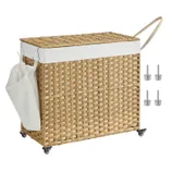 A wicker laundry hamper with a fabric liner, featuring a side pocket, wheels, and a handle. Four screws are shown beside it.