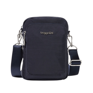 A compact, navy blue crossbody bag with a detachable strap, featuring a front zippered pocket and silver hardware.
