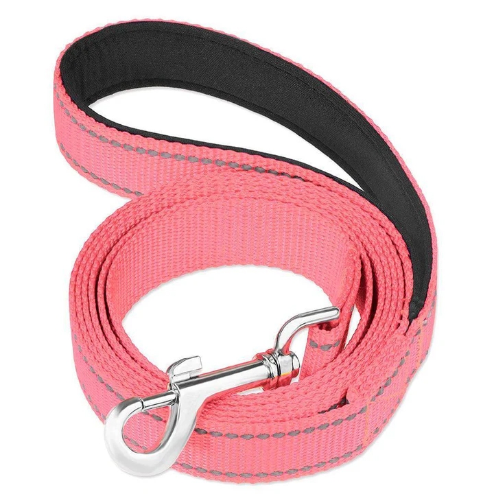 A pink dog leash with a silver clip, featuring reflective stitching and a padded black handle for comfort.