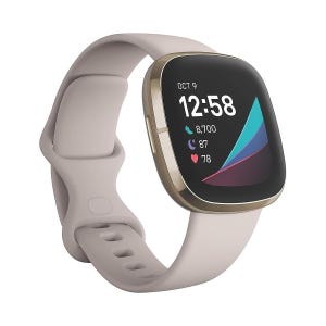 A smartwatch with a gold-tone case, color display showing time, fitness metrics, and a beige band.