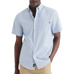 Light blue short-sleeve button-up shirt featuring a chest pocket, worn with beige pants.
