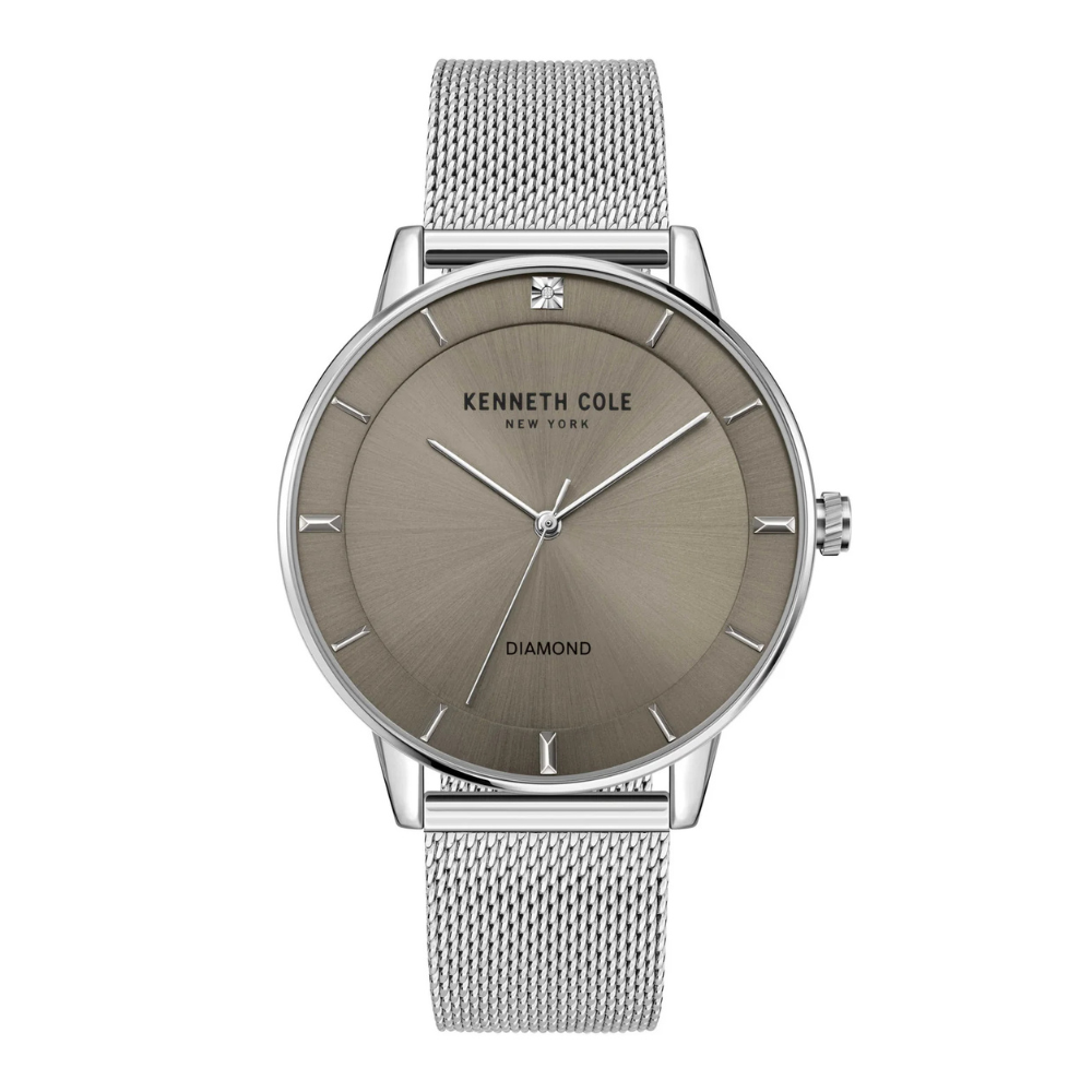 A Kenneth Cole New York watch featuring a metallic mesh band, minimalist design, and diamond detail on the dial.
