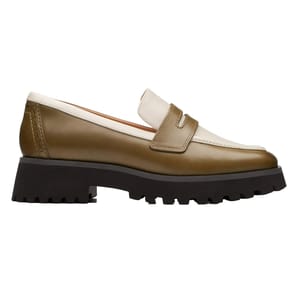 The Clarks Stayso Edge shoes are stylish loafers featuring an olive green body with white accents and a distinctive black chunky lug sole, offering a blend of elegance and ruggedness.