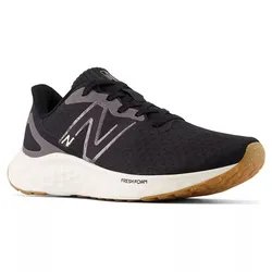 A black athletic running shoe with a white and gum sole features the New Balance logo and Fresh Foam cushioning.
