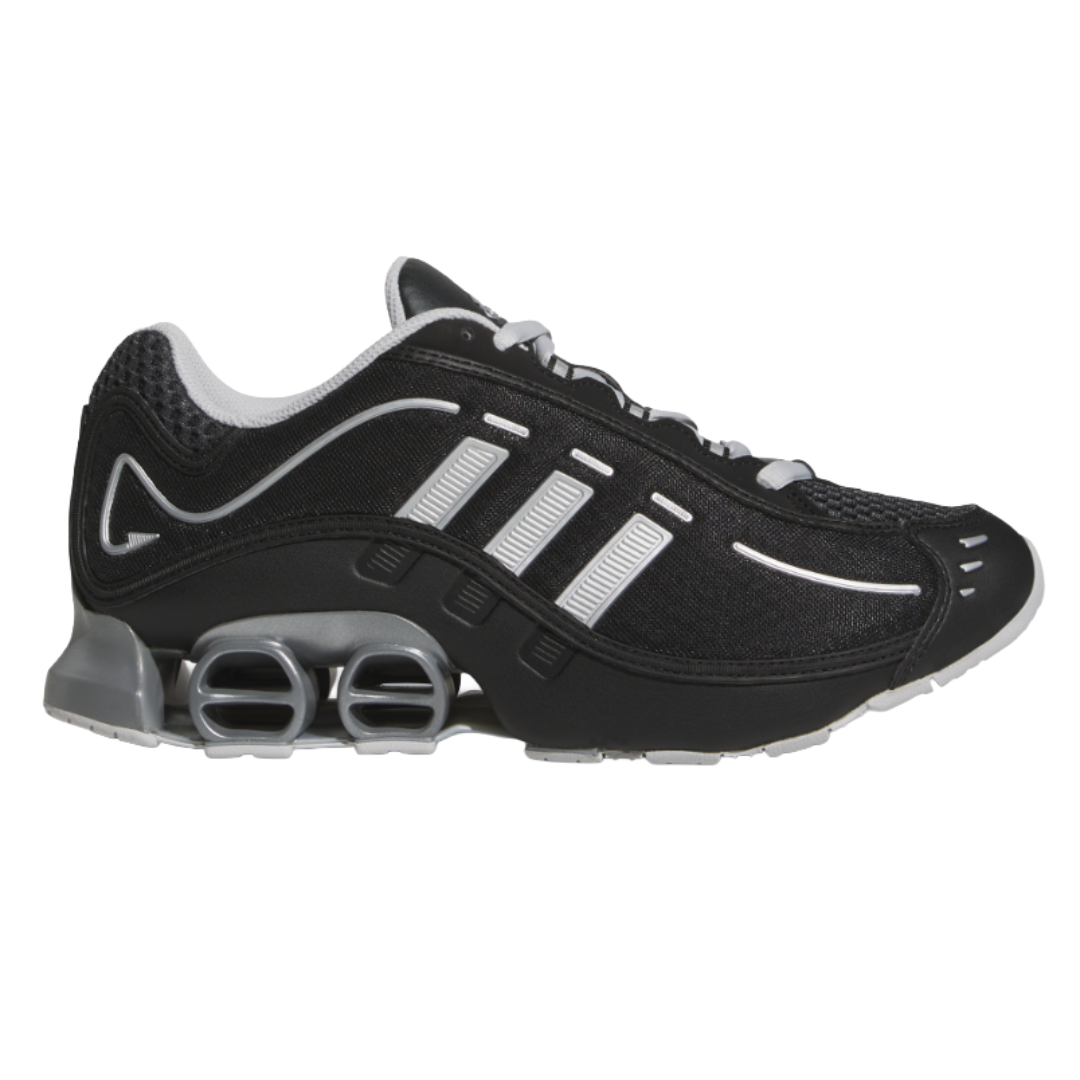 A black and gray athletic shoe with white detailing and distinctive spring-like cushioning in the sole.