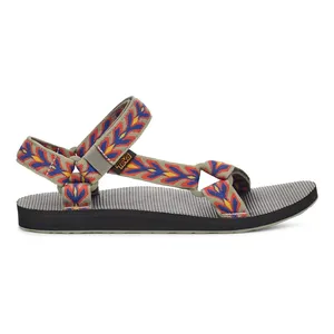 A sandal with a textured gray sole and multicolored, adjustable straps featuring a red and blue leaf pattern with a small brand tag.