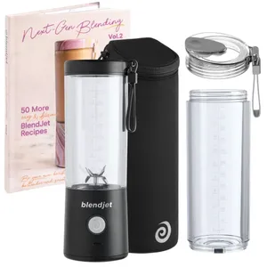 A portable blender set including a BlendJet blender, extra jar, travel sleeve, recipe book (Next-Gen Blending Vol. 2), and a lid with a strap.