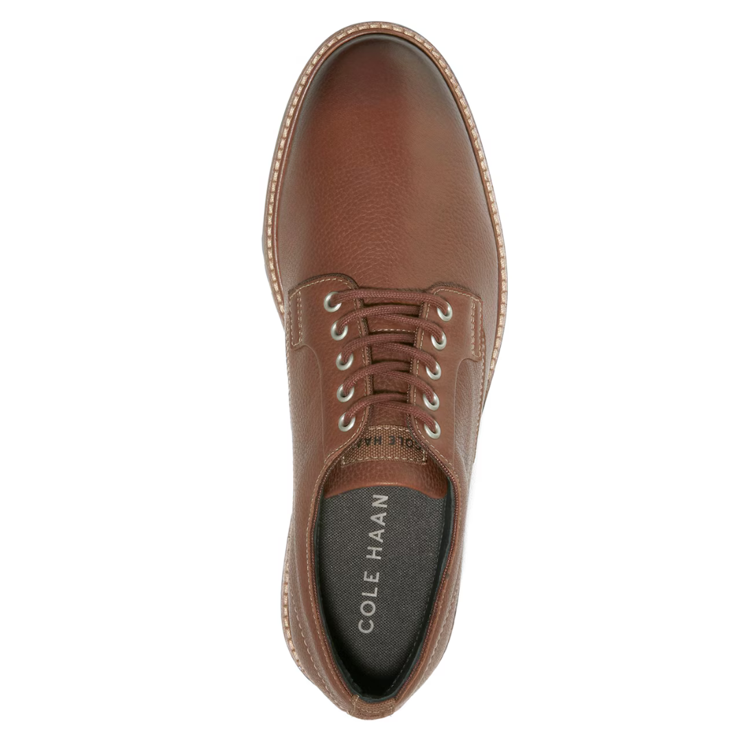 Brown leather dress shoe with laces and stitched details, branded as Cole Haan.