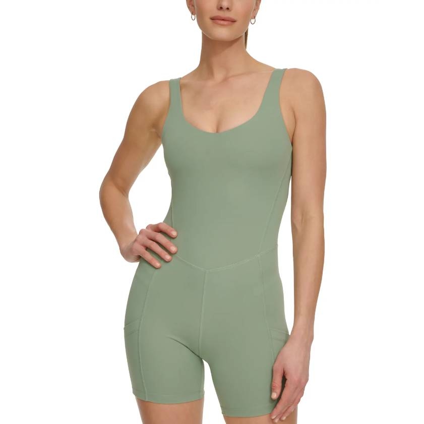 A light green DKNY bike short unitard featuring a scoop neckline, wide shoulder straps, and fitted silhouette with side pockets.