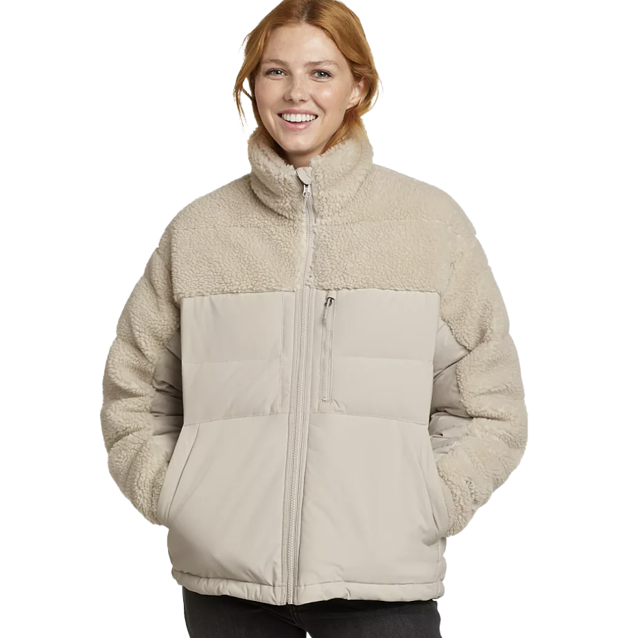 A two-tone jacket with a high collar and a horizontal quilted pattern on the lower half, featuring sherpa-like material on the upper section and sleeves.