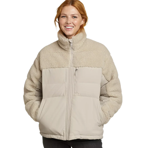 A two-tone jacket with a high collar and a horizontal quilted pattern on the lower half, featuring sherpa-like material on the upper section and sleeves.