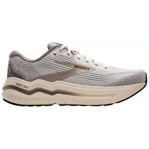 A Brooks Ghost Max running shoe in shades of gray and beige, featuring a cushioned sole and breathable upper design.